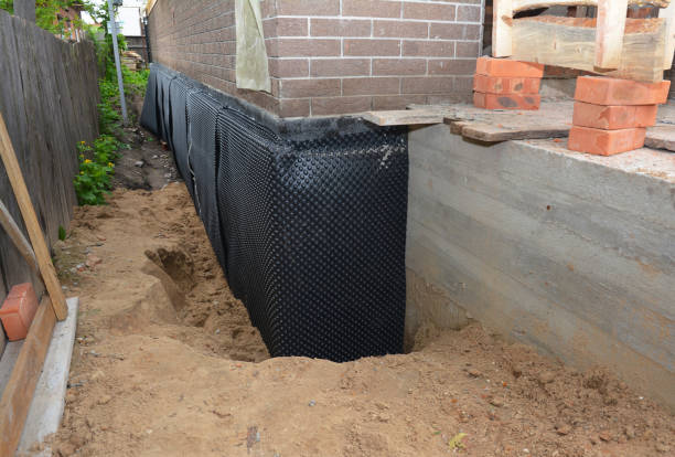Happy homeowners after waterproofing job in Walland